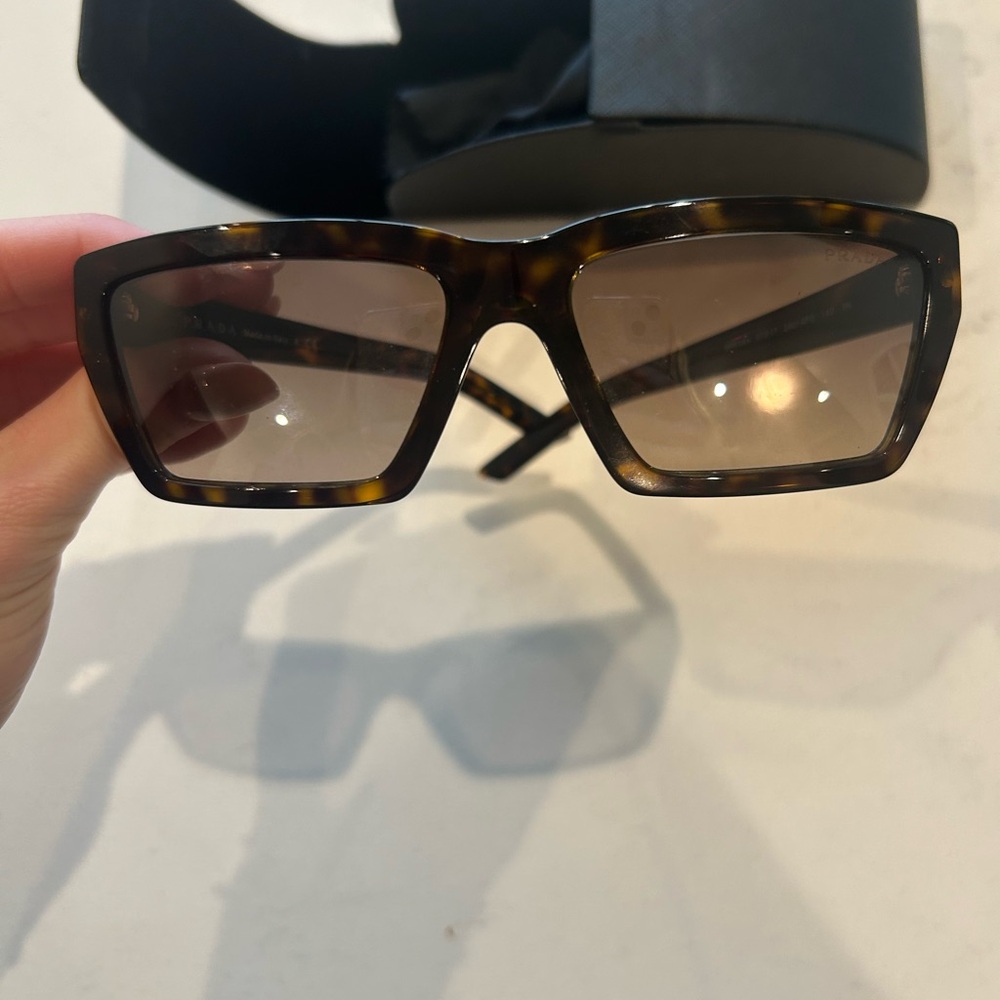 Prada Brown Sunglasses with Bold Frame and Tinted Lenses